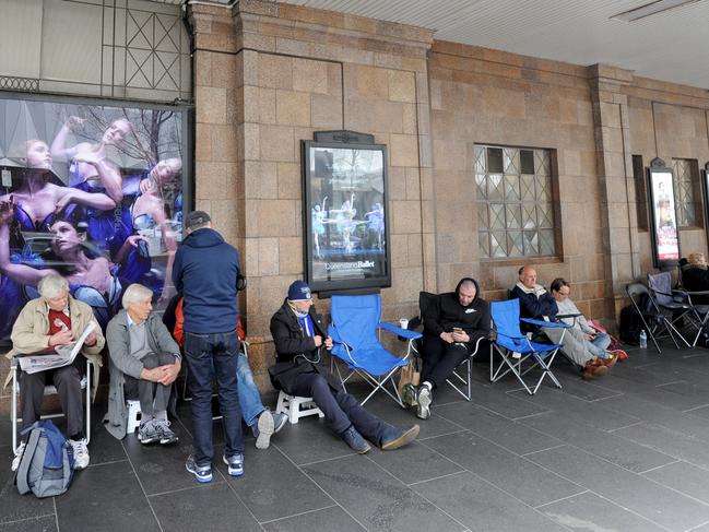 Collingwood fans line up for Grand Final tickets outside a Ticketek outlet on Sunday. Picture: Andrew Henshaw