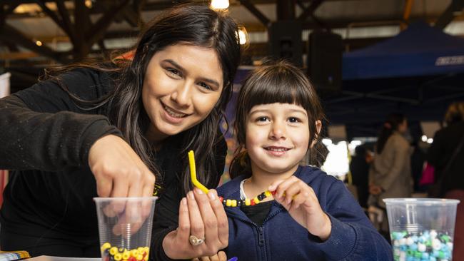 Brooklyn Gwilliams gets a hand from mum Shantelle Gwilliams on a craft stall at Toowoomba NAIDOC Week celebrations at The Goods Shed, Monday, July 4, 2022. Picture: Kevin Farmer