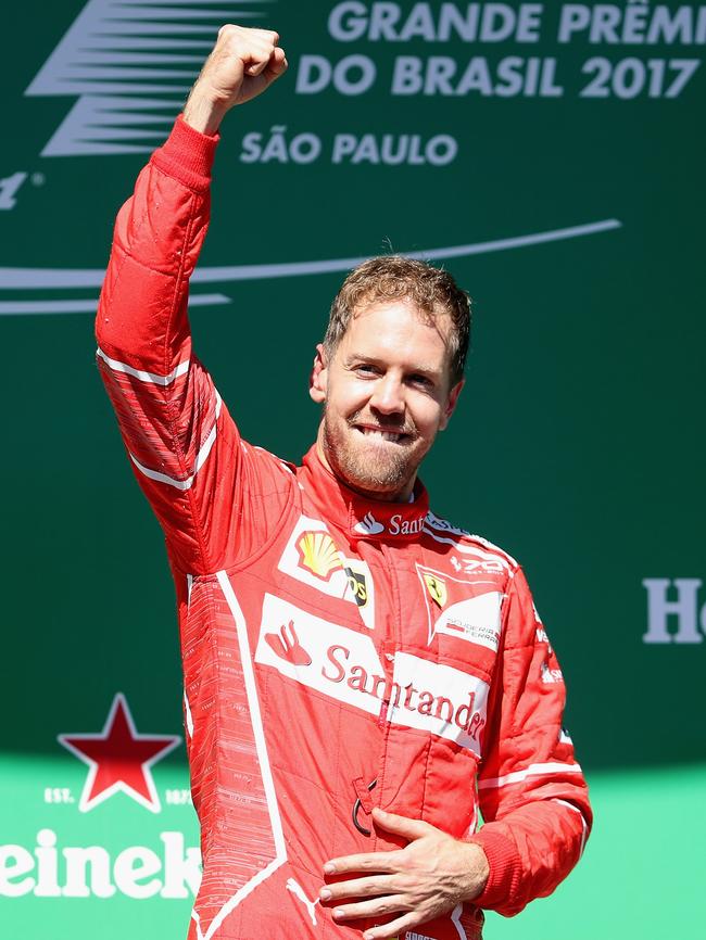 Race winner Sebastian Vettel celebrates on the podium. Photo: Getty Images