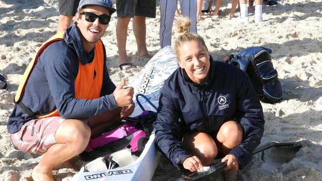 Ironwoman Allie Britton (right) and boyfriend, ironman Tanyn Lyndon, ahead of the Coolangatta Gold. Britton has now been ruled out of most of the summer with a foot injury. Photo: Harvpix