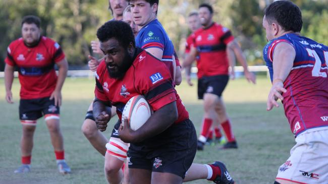 Gold Coast District Rugby Union (GCDRU) Round Six clash between Griffith Uni Colleges Knights (Red/Black) and Bond Pirates (Blue/Red) at Heeb St, Benowa. Lesi Semi carries. Pic Mike Batterham