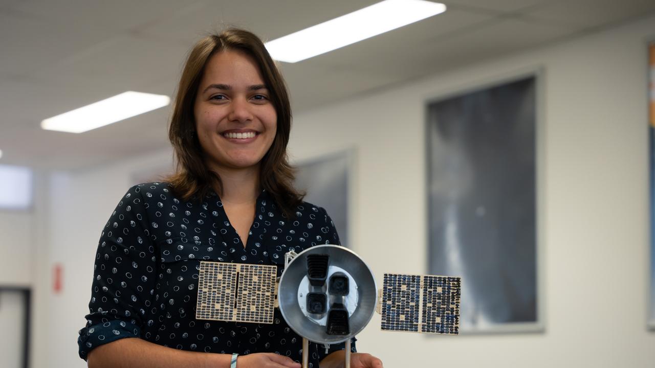 Emma Nabbie holding a model of the Transiting Exoplanet Survey Satellite (TESS), the NASA space mission that first discovered the planet TOI-3261b. Photo supplied