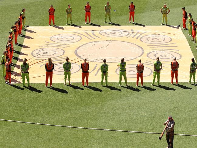 SYDNEY, AUSTRALIA - NOVEMBER 15: The Scorchers and Thunder teams stand together barefoot on field as part of National NAIDOC Week 2020 before the Women's Big Bash League WBBL match between the Sydney Thunder and the Perth Scorchers at GIANTS Stadium, on November 15, 2020, in Sydney, Australia. (Photo by Mark Kolbe/Getty Images)