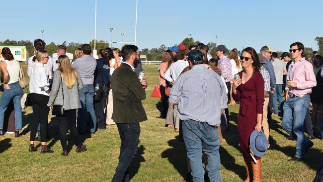 Spectators cheer on as they watch the B Grade St George vs Condamine match at the Roma Rugby Races at Bassett Park. Picture: Chloe Cufflin.
