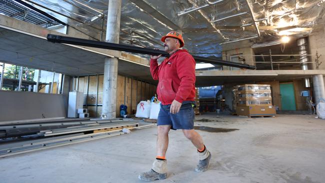 Danny Winther working on the new library building in PAYCE’s Washington Park development in Riverwood. Picture: Angelo Velardo