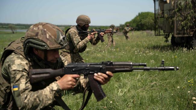 Soldiers from the Ukrainian 33rd Separate Mechanised Brigade train at an undisclosed location in eastern Ukraine, amid the Russian invasion. Picture: AFP