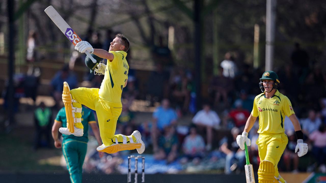 Australia's David Warner celebrates after scoring a century. Photo by PHILL MAGAKOE / AFP.