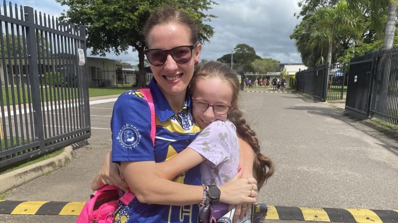 Upper Ross Community Voice chairwoman Krystle Lewis and Bianca Lewis, 11, head to the Thuringowa State High School voting booth. Picture: Chris Burns