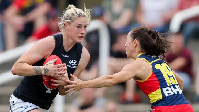 Tayla Harris, of the Blues, evades Sophie Li, of the Crows. Picture: Getty