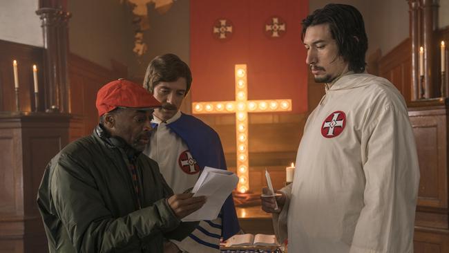 Director Spike Lee, left, with actors Topher Grace, centre, and Adam Driver on the set of Lee's film BlacKkKlansman. Picture: Focus Features/AP