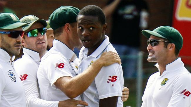 South Africa's Kagiso Rabada, second right, celebrates a wicket with team mates during the second cricket test match between South Africa and Australia at St George's Park in Port Elizabeth. Pic: Michael Sheehan.