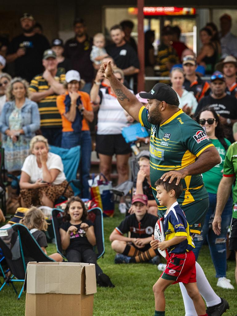 Sam Thaiday runs out with Danes junior Wylie Bunyab.