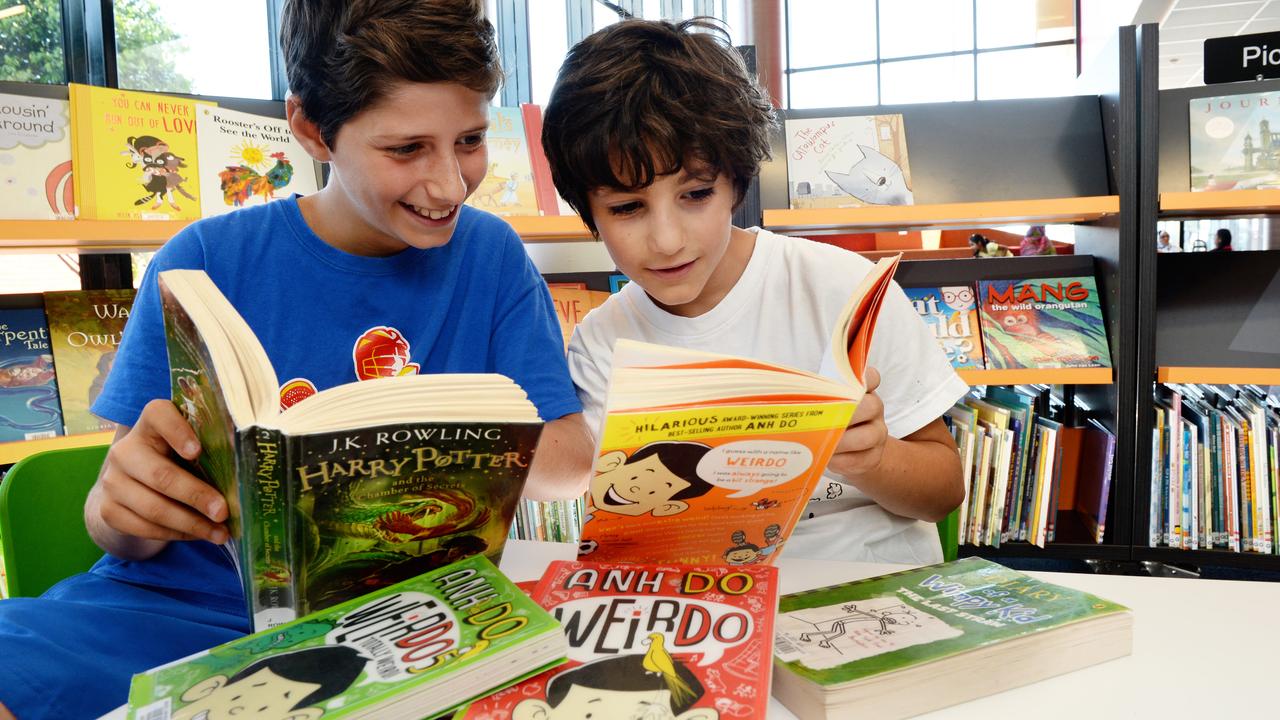 Books by Australian authors, including Anh Do, are tops with brothers Ridvan and Yasin, who also enjoy the Harry Potter and Wimpy Kid books. Picture: Steve Tanner