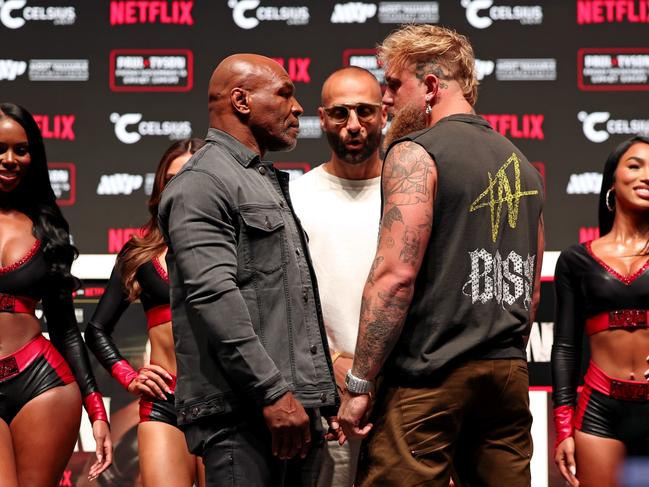 DALLAS, TEXAS - NOVEMBER 13: (L-R) Mike Tyson, Nakisa Bidarian, and Jake Paul attend the press conference for LIVE on Netflix: Jake Paul vs. Mike Tyson at the Toyota Music Factory on November 13, 2024 in Dallas, Texas. (Photo by Brett Carlsen/Getty Images for Netflix ÃÂ© 2024)