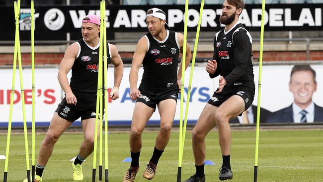 Port Adelaide’s Ollie Wines, Cameron Sutcliffe and Justin Westhoff at training. Picture: Sarah Reed