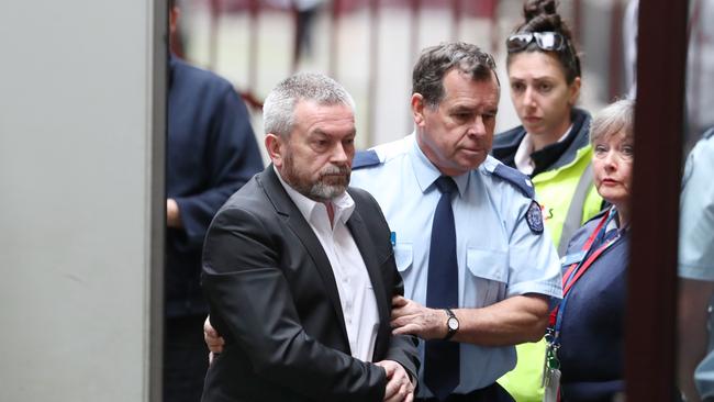 Borce Ristevski arrives from a prison van in August last year. Picture: David Crosling