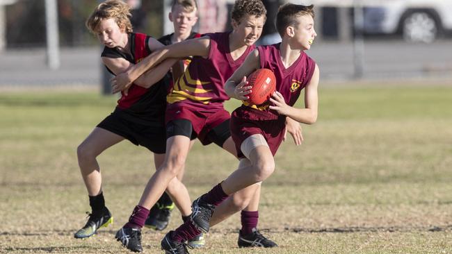 Gawler and Riverland square off at the School Sport SA Sapsasa Country Football Carnival at West Beach. Picture: Simon Cross