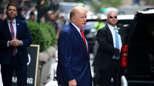 Former US President Donald Trump walks to a vehicle in New York City. (Photo by STRINGER / AFP)