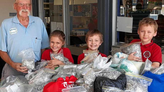 RICH PICKINGS: Wayne Hayes of Ringpull with Rachel, Declan and James from Parkhurst State School. Picture: Jann Houley