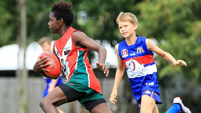 South Cairns McLoffty Gaidan breaks away from Centrals Noah Baker during action at AFL match, South Cairns Red versus Centrals TB Red at Fretwell Park. PICTURE: JUSTIN BRIERTY