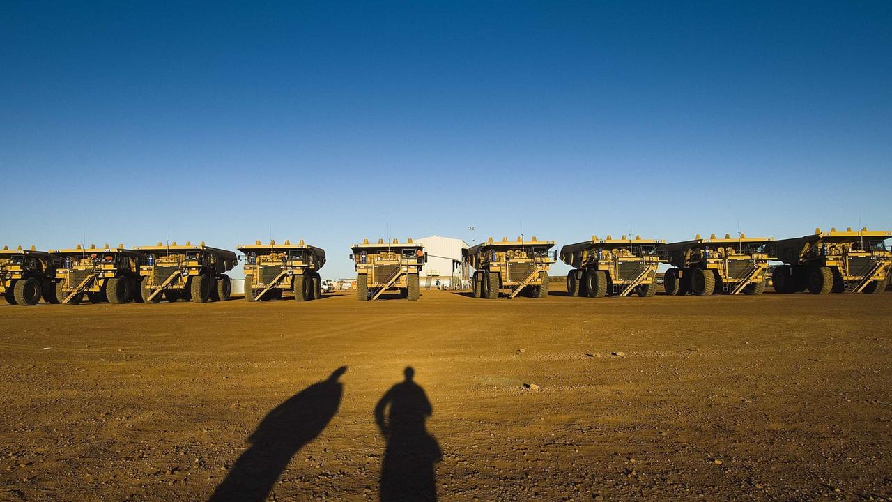 A fleet of mining trucks line up at the Murrin Murrin Mine site in Western Australia. Picture: Evan Collis/Bloomberg News