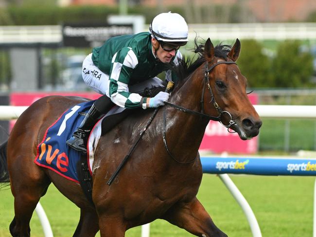 MELBOURNE, AUSTRALIA - AUGUST 31: Mark Zahra riding Growing Empire winning Race 6, the Ive > Mcneil Stakes - Betting Odds  during Melbourne Racing at Caulfield Racecourse on August 31, 2024 in Melbourne, Australia. (Photo by Vince Caligiuri/Getty Images)