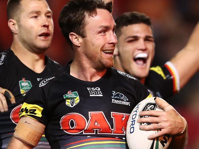 James Maloney of the Panthers celebrates with team mates after scoring a try during the Round 21 NRL match between the Penrith Panthers and the Canberra Raiders at Panthers Stadium in Sydney, Sunday, August 5, 2018. (AAP Image/Brendon Thorne) NO ARCHIVING, EDITORIAL USE ONLY