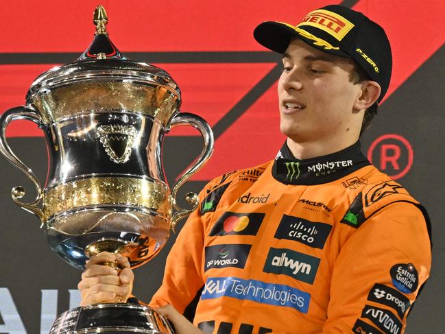 McLaren's Australian driver Oscar Piastri holds the trophy during the Bahrain Formula One Grand Prix at the Bahrain International Circuit in Sakhir on April 13, 2025. (Photo by Andrej ISAKOVIC / AFP)