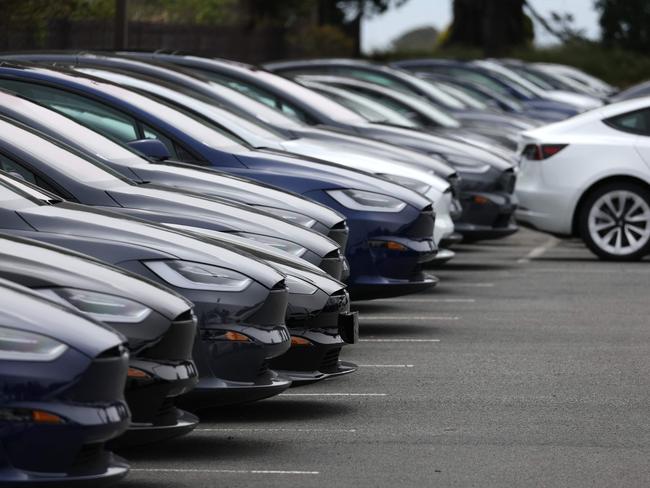 (FILES) Brand new Tesla cars are displayed on the sales lot at a Tesla dealership on May 16, 2023 in Colma. Electric car maker Tesla has initiated a recall of about two million vehicles in the United States over a risk linked to its autopilot software, the US traffic safety regulator said on December 13, 2023. "Tesla has now filed a safety recall with the agency related to its Autopilot software system," the National Highway Traffic Safety Administration (NHTSA) said, adding that "affected vehicles will receive an over-the-air software remedy." (Photo by JUSTIN SULLIVAN / GETTY IMAGES NORTH AMERICA / AFP)