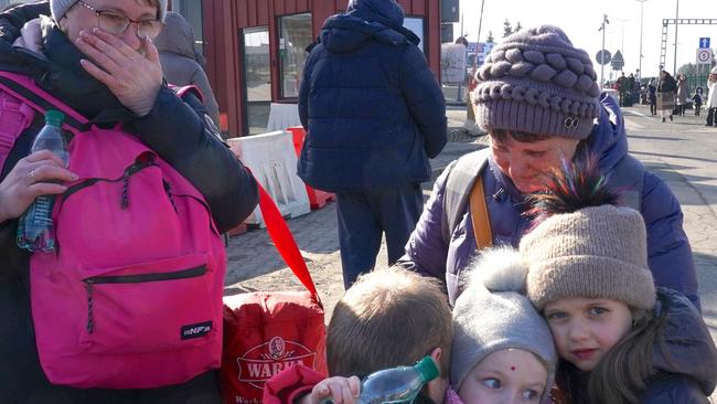 Ukrainian women and children cross the border from Ukraine to Poland. Picture: Janek Skarzynski /AFP