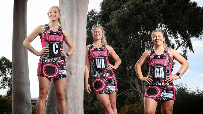 Adelaide Thunderbirds’ Tayla Williams, Chelsea Pitman and Georgie Horjus wearing the team’s Indigenous Round dress ahead of their match against NSW Swifts in Cairns. Picture: Sarah Reed