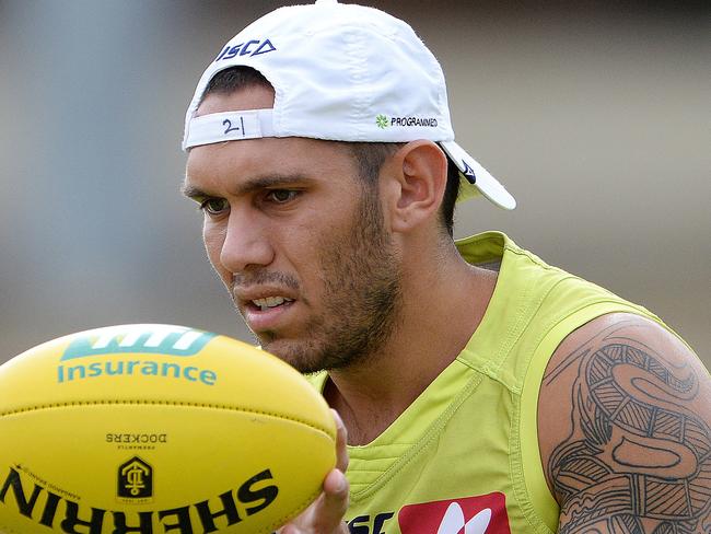 SPORT - The Fremantle Dockers train ahead of their season opener on Sunday. Photo by Daniel Wilkins. PICTURED- Harley Bennell does some handball drills during training