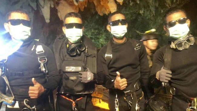 The last four Thai Navy SEALs to emerge from the cave.