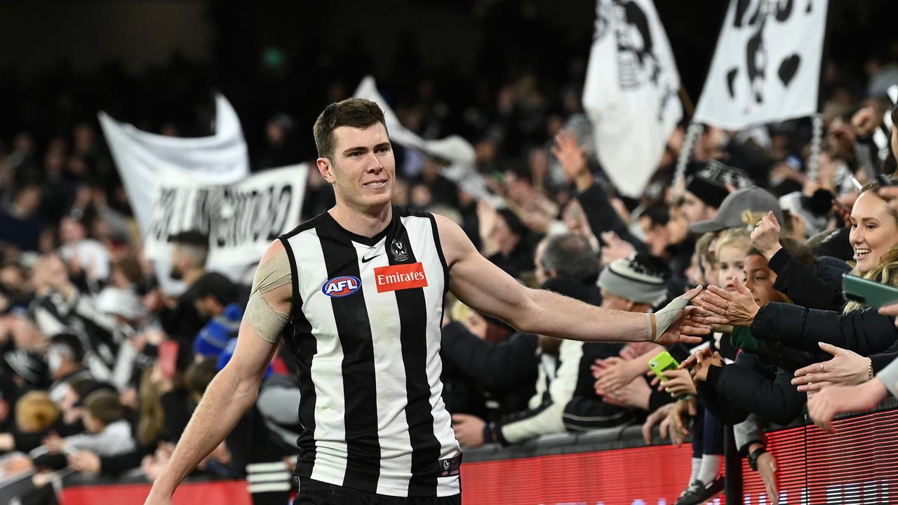 Mason Cox celebrates with the Magpie army. Picture: Quinn Rooney/Getty Images