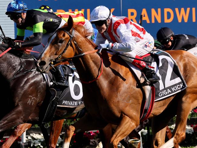 Giga Kick (R), ridden by Craig Williams, wins the Everest 2022 horse race at the Royal Randwick race course in Sydney on October 15, 2022. (Photo by DAVID GRAY / AFP) / XGTY-- IMAGE RESTRICTED TO EDITORIAL USE - STRICTLY NO COMMERCIAL USE --