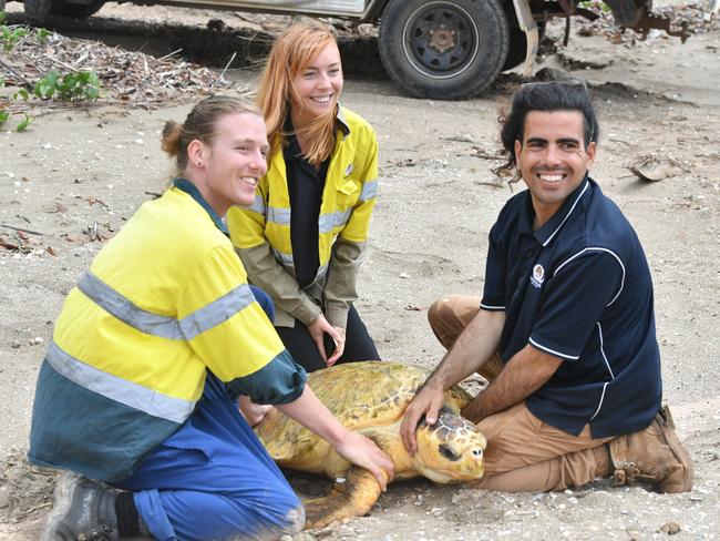 Jake Haber, Kirsten Smith and Matt Lynn with Poly the loggerhead turtle on Quoin Island on October 16.