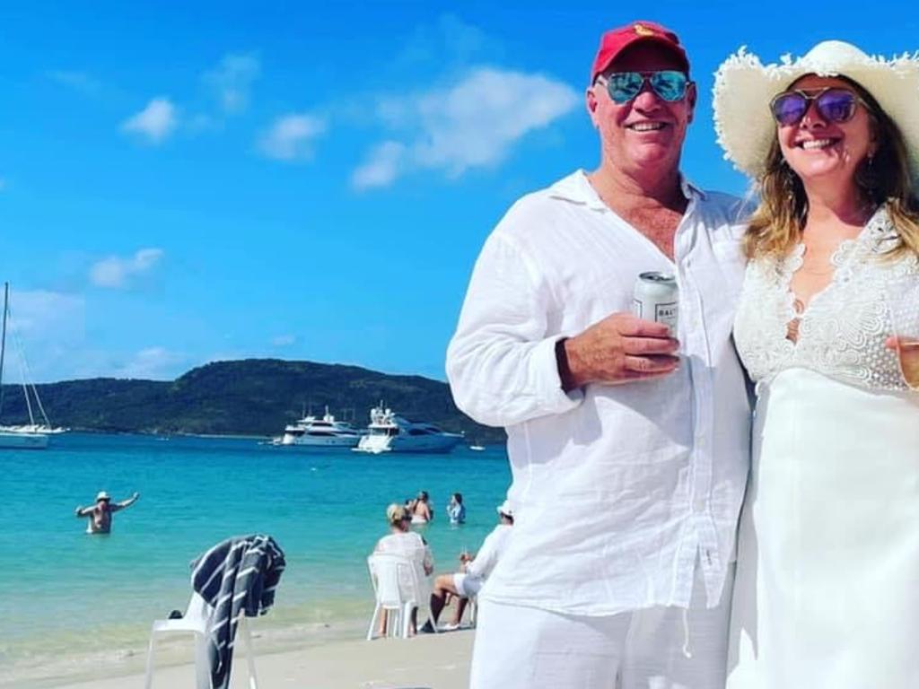 Organiser Kevin Collins (left) with a friend on Whitehaven Beach on a sunny day. He says a survey has been sent to attendees seeking feedback. Picture: Facebook