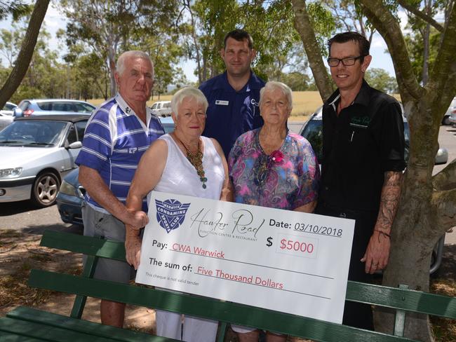 Community man: Bully Bell (left) with the $5000 cheque for drought support in 2018. (Photo: Gerard Walsh).