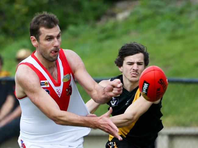 Action from Peninsula FL Rd.16 match between Seaford and Karingal. Seaford came away with the win 13. 16 (94) to Karingal's 3. 4 (22).  Karingal's Luke Vanraay gets a handball away. Picture: David Trend