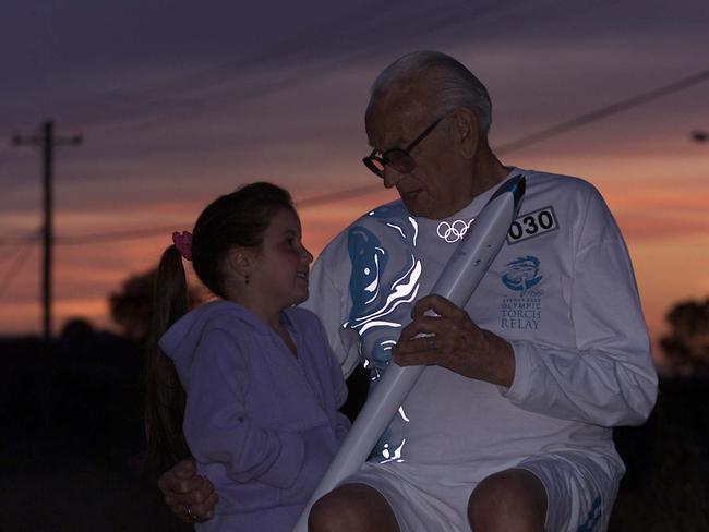 September 04, 2000: John Scollen, 82, and great granddaughter Brodie Garnsey, 5, during sunrise at Luddenham. Picture: Glen Campbell