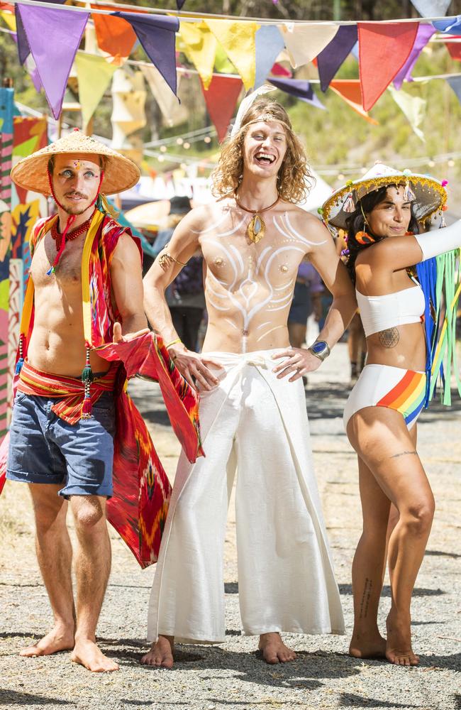 Hamish Doncaster from Byron Bay, Lucas Vignaud from France and Nica Cor from Brazil, get into the spirit at the Woodford Folk Festival, 2019. Photo Lachie Millard