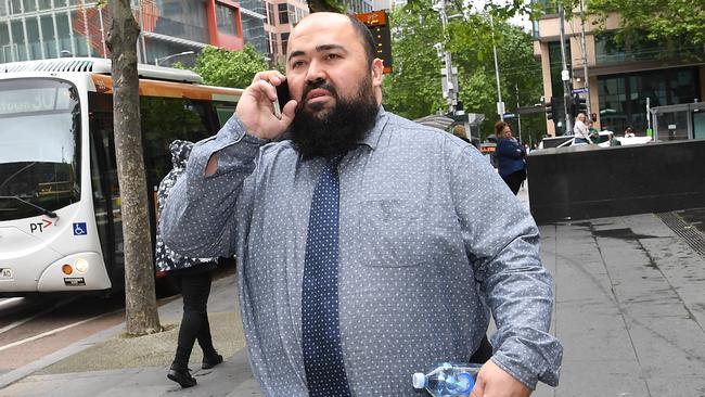 Isa Kocoglu leaves the County Court after avoiding a jail sentence. Picture: AAP Image/Julian Smith