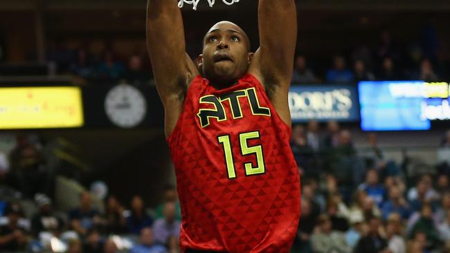 Al Horford of the Atlanta Hawks makes a slam dunk against the Dallas Mavericks at American Airlines Center.