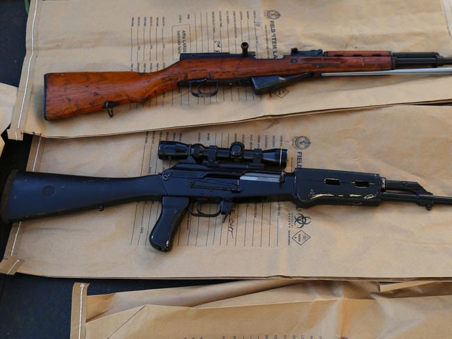 Three semi-automatic SKS rifles, an assault rifle, a shotgun and 2000 rounds of ammunitions were also discovered in hidden compartments built into wardrobes on premises at  Greystanes when heavily armed officers from Strkeforece talon and the South west metropolitan regional enforcement squad served Firearms Prohibition Order on two men  linked to the rebels motorcycle gang  at just after 6.30am yesterday. Picture: NSW Police