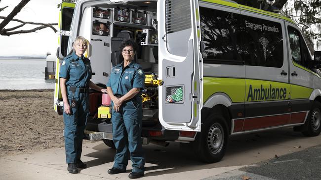 Vikki Harvey, 50, and Beverly Geronimos, 59, are volunteer paramedics, who are on-call whenever they are home on Coochiemudlo Island. Picture: Mark Cranitch.