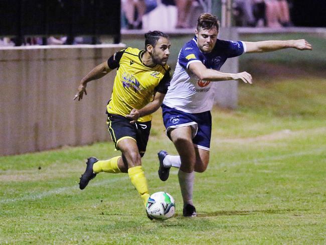 Tigers' Oscar Rodriguez Zaballos takes on Rangers' Jordan Quinn in the FNQ Football Premiership match between the Edge Hill Tigers and the Marlin Coast Rangers, held at Tiger Park, Manunda. Picture: Brendan Radke