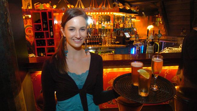 Bartender Tess McLachlan serves up drinks to celebrate completion of the redevelopment of Boho at the Unley on Clyde hotel in 2005. Picture: Brenton Edwards