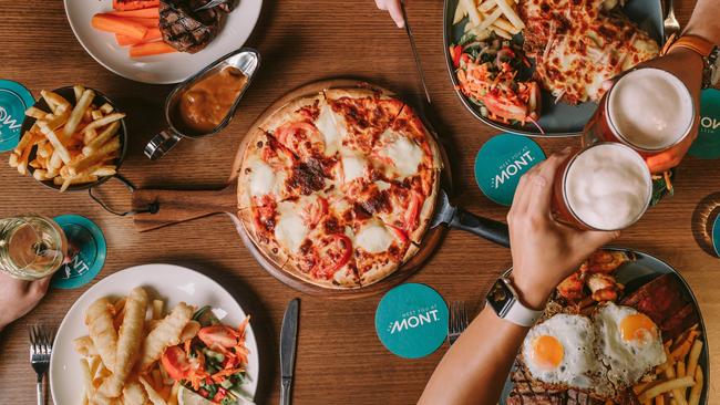 Food at Claremont Hotel (The Mont). clockwise from bottom left:  fish & chips, scotch fillet, parmi, mixed grill and pizza (centre). For Alix Davis Indulge column in TasWeekend. Picture: Supplied