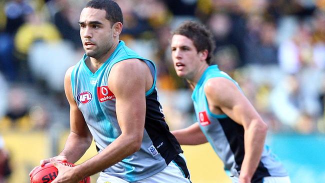 Shaun Burgoyne for Port ahead of a young Travis Boak in 2007.