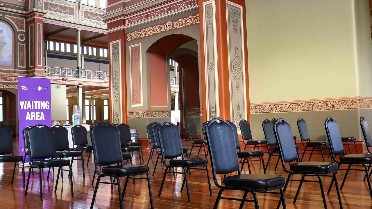 Empty chairs await people at the Royal Exhibition Building in Carlton to receive their AstraZeneca vaccine. Picture: Ian Currie/NCA NewsWire